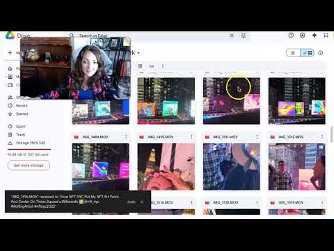 A woman with long hair sits in front of a computer screen displaying a gallery of videos from an NFT art event.